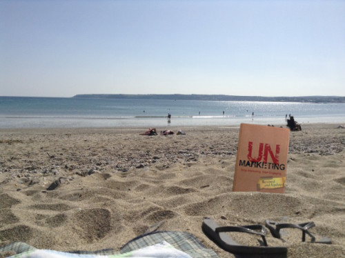 UnMarketing book on a beach